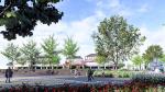Zicht vanaf het Kerkplein in Malden richting Rijksweg en winkelcentrum. Langs de weg komt een soort tribune. © Gemeente Heumen