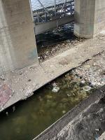This picture shows plastics and garbage waste in the water 