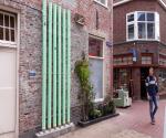 Water Wall buffersystem incorporated with plants and flowers and a bee shelter to stimulate urban biodiversity