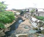 Further downstream (but also in the upstream) the river is black from the pollution and there is also plastic waste in the river 