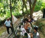 People doing laundry along the Mahiga Creek