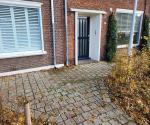 Afgekoppelde regenpijp trottoir Kruisvaardersstraat Tilburg